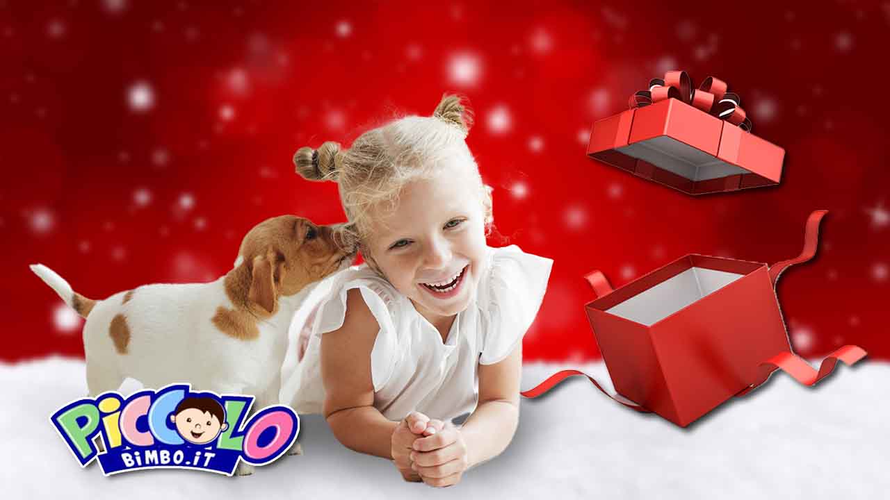 bambina cucciolo di cane natale